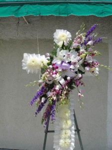 Purple Roses and Lavender Fiji Chrysanthemum Centered With White Lilies Standing Cross 
